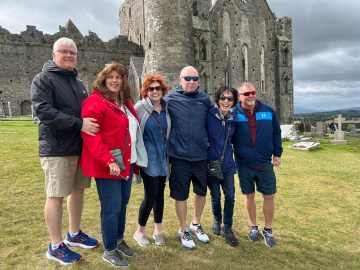Small group of travelers visiting Castle outside of Galway